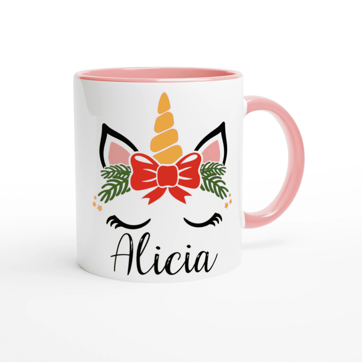 Mug blanc illustration licorne de Noël avec nœud central, anse rose et intérieur rose pâle.