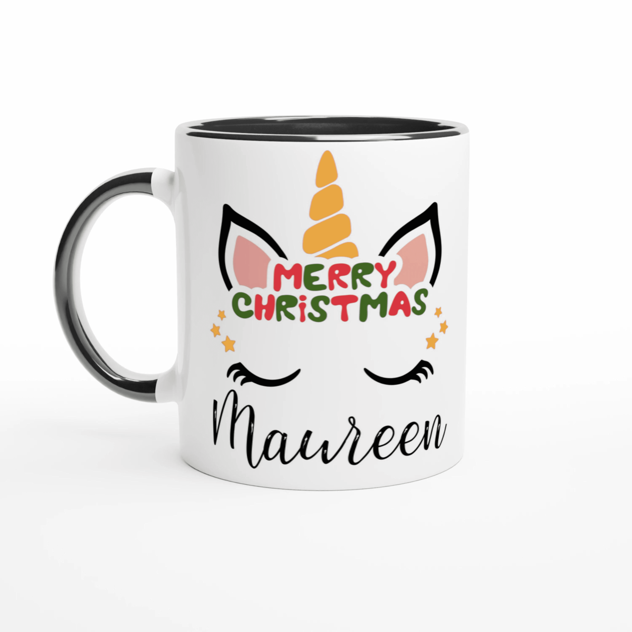 Mug licorne de Noël avec inscription Merry Christmas, anse noire et intérieur noir, décor festif sur fond blanc.