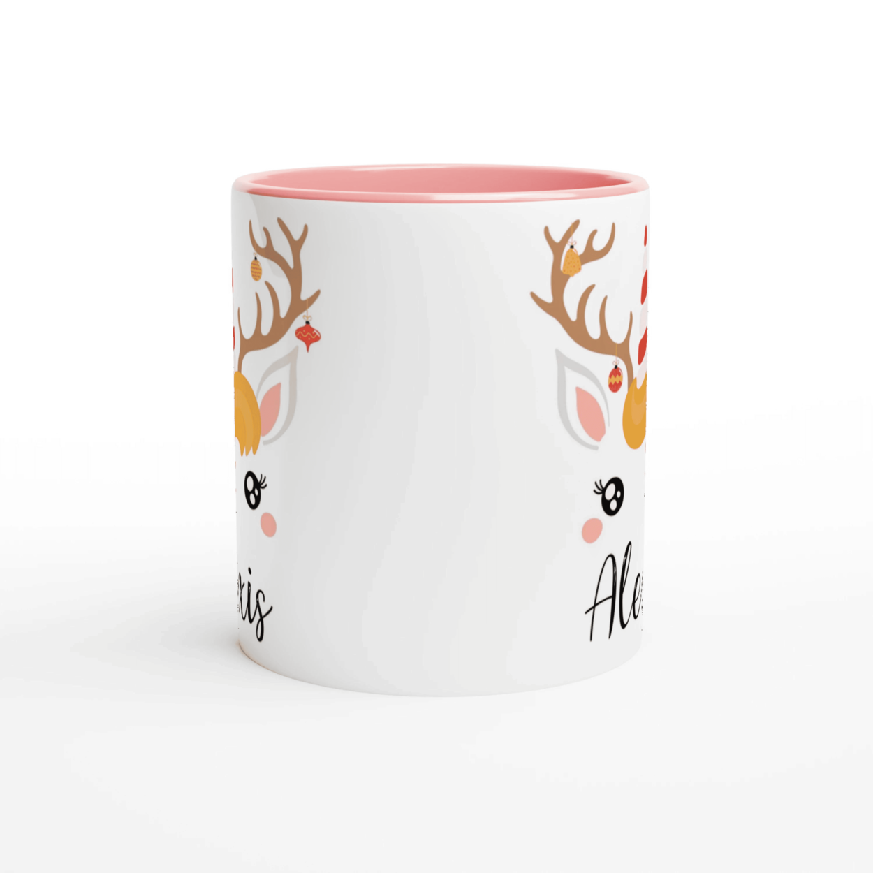 Mug de Noël licorne renne avec bois décorés, corne festive rouge et blanche, anse rose et intérieur rose.