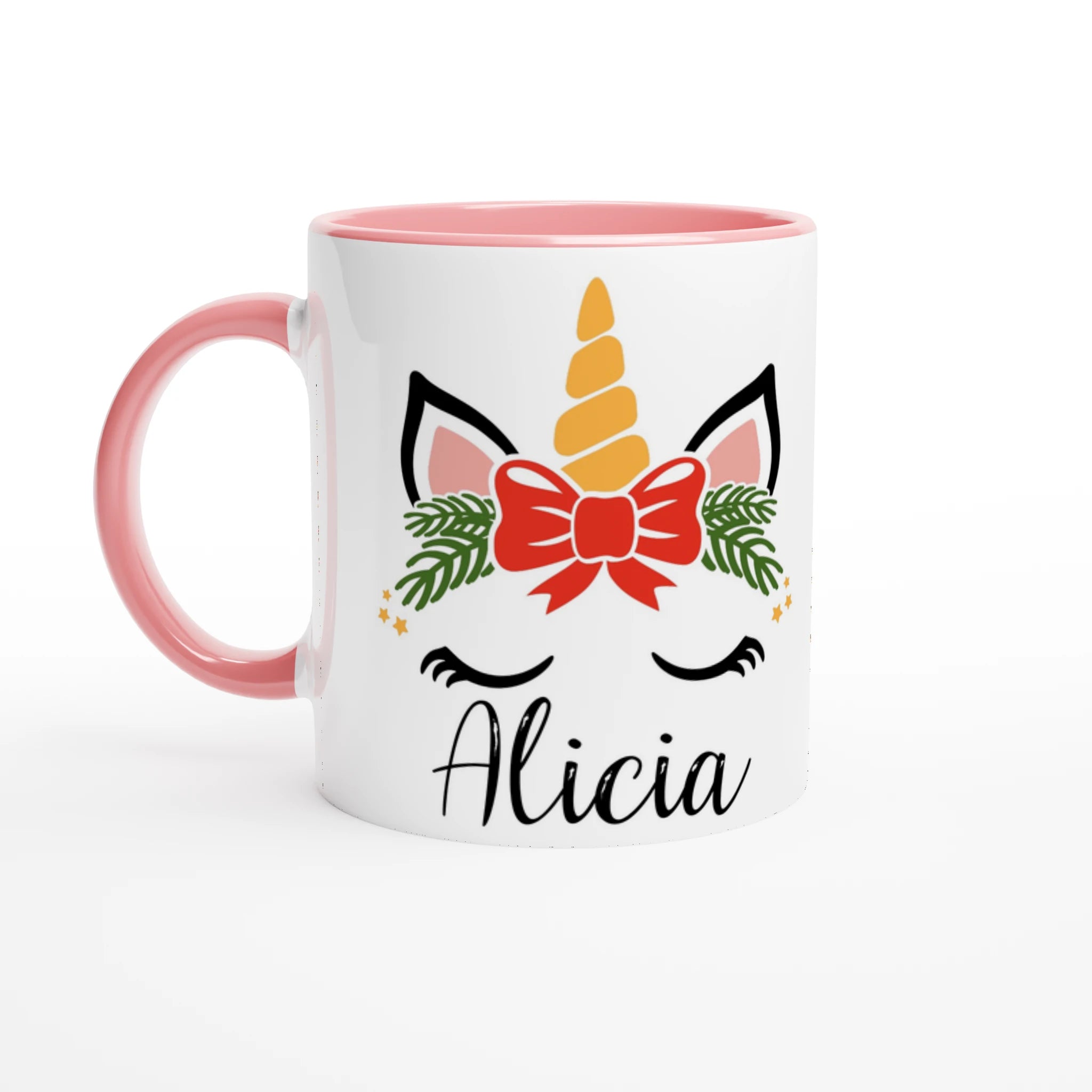 Mug blanc illustration licorne de Noël avec nœud central, anse rose et intérieur rose pâle.