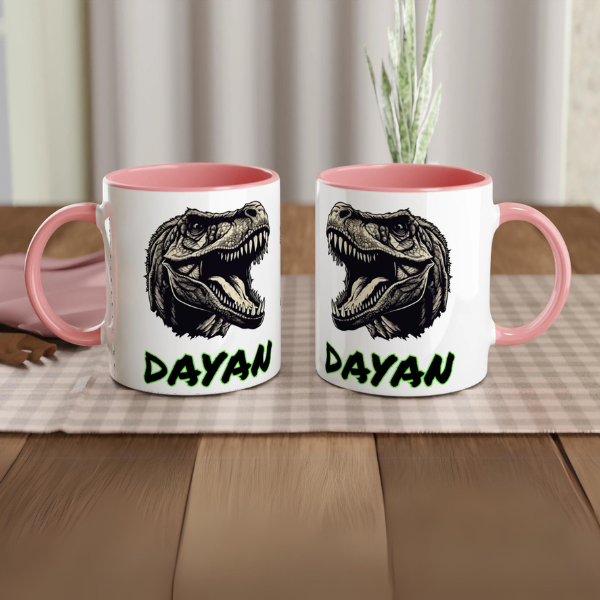 Mug avec motif T-Rex noir et prénom, intérieur rose, idéal pour les petits fans de dinosaures.